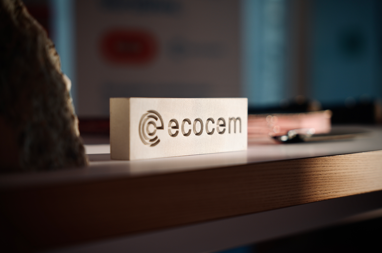 A small concrete block with the Ecocem logo engraved into it.